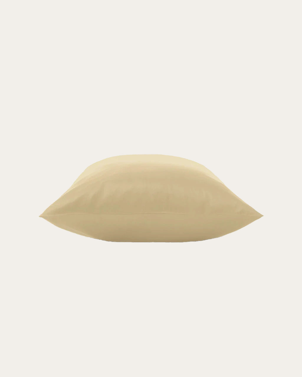 Beige satin pillowcase on a bed, adding elegance and comfort to your bedroom decor.
