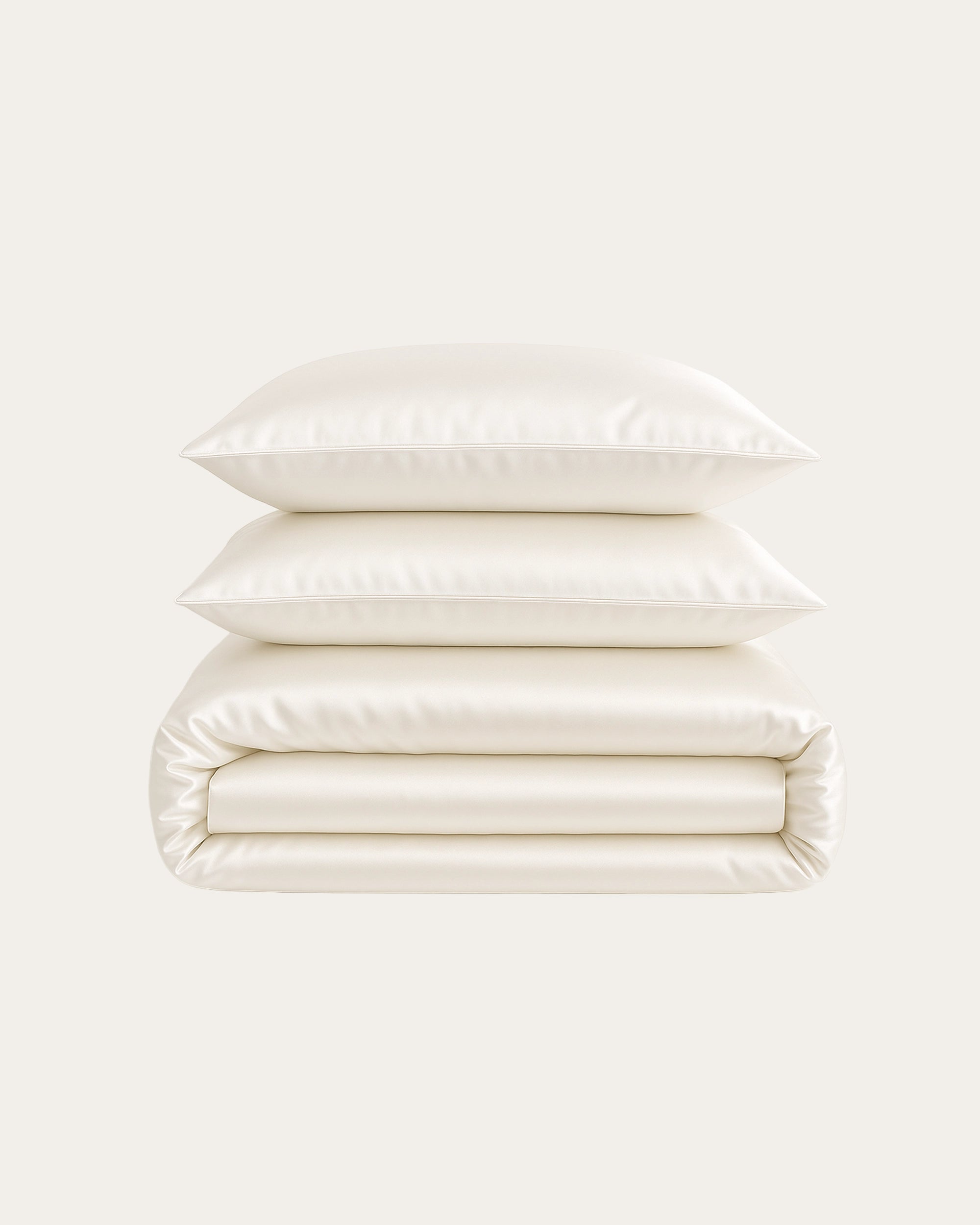 White Satin Bedding Set featuring silky sheets and matching duvet for a luxurious bedroom atmosphere.