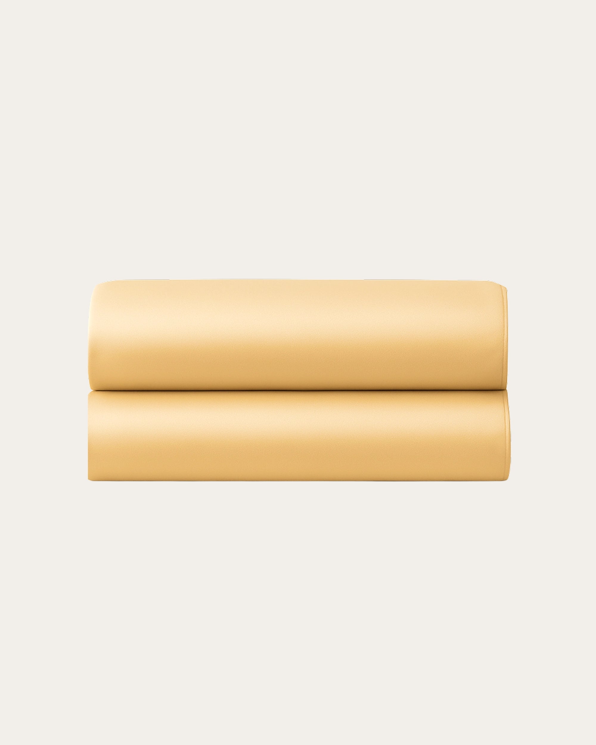 Beige satin fitted sheets folded neatly, showcasing elegant texture and warm color.