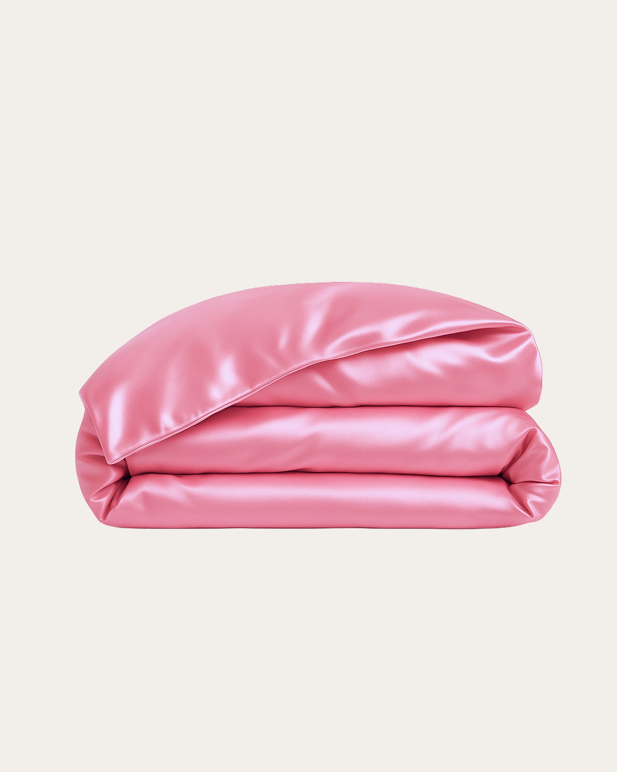 Blossom Pink Satin Duvet Cover folded, showcasing its silky texture and modern design for elegant bedroom decor.
