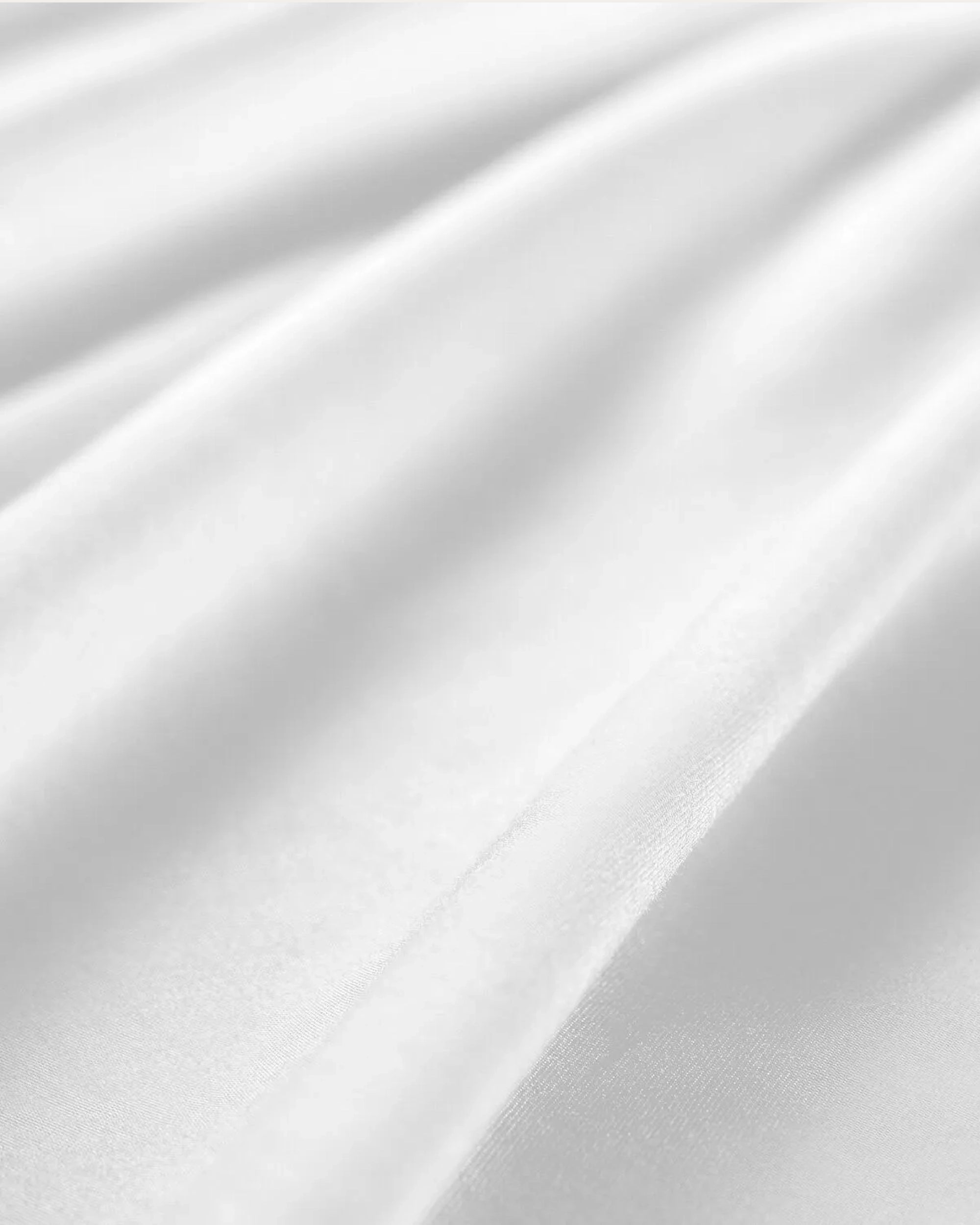 Frost white satin Oxford pillowcase crafted for ultimate softness and luxury, bringing a bright, elegant, and sophisticated touch to your bedroom.