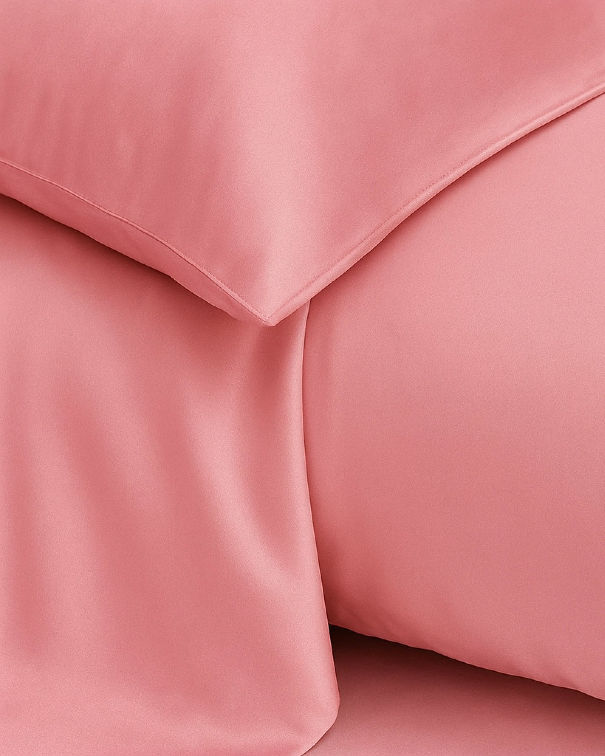 Oxford-style pillowcase in blossom pink satin, offering a blend of elegance, comfort, and silky smoothness for peaceful nights.
