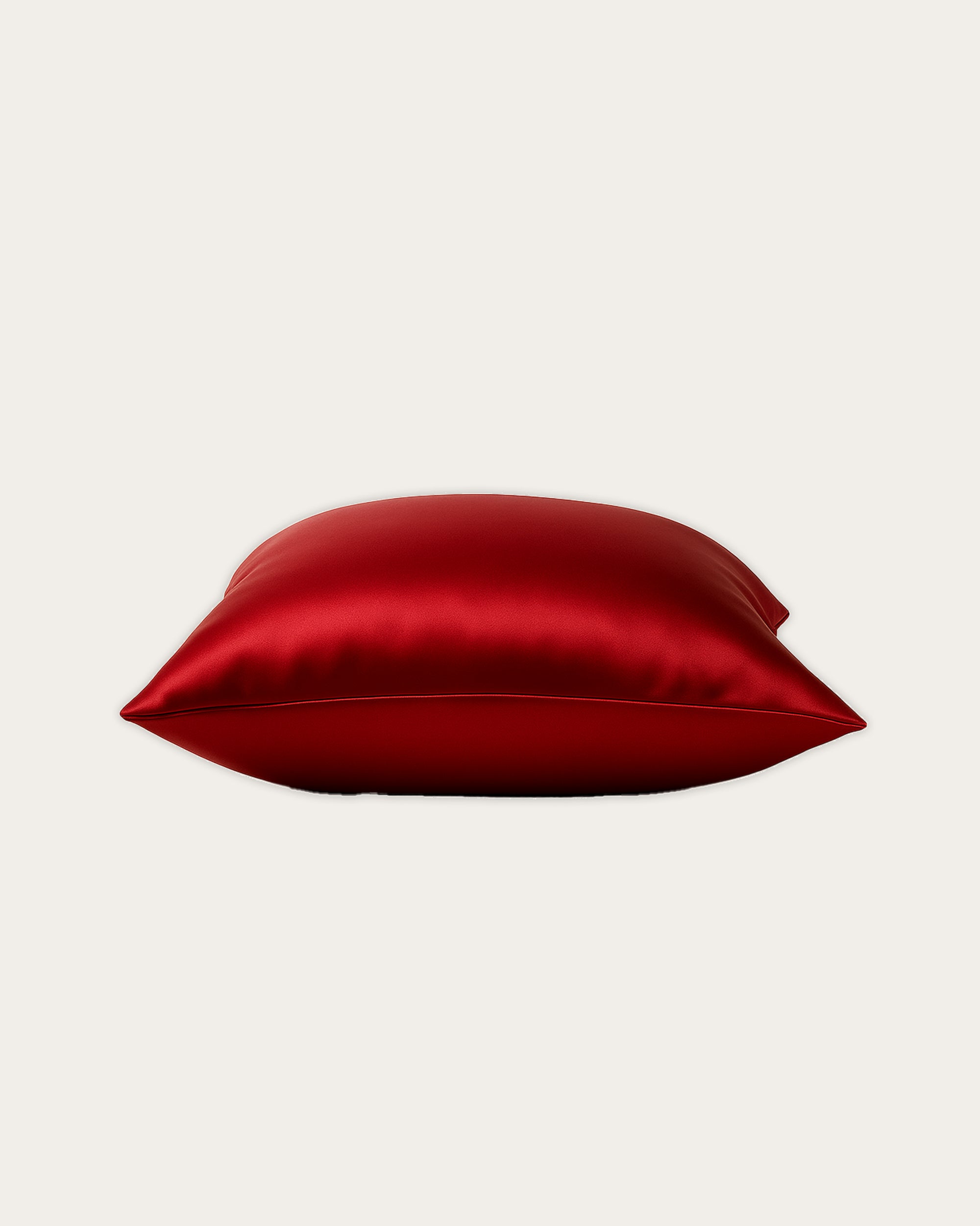 Imperial Red Satin Pillowcase showcasing smooth texture and vibrant color for a luxurious bedroom decor.