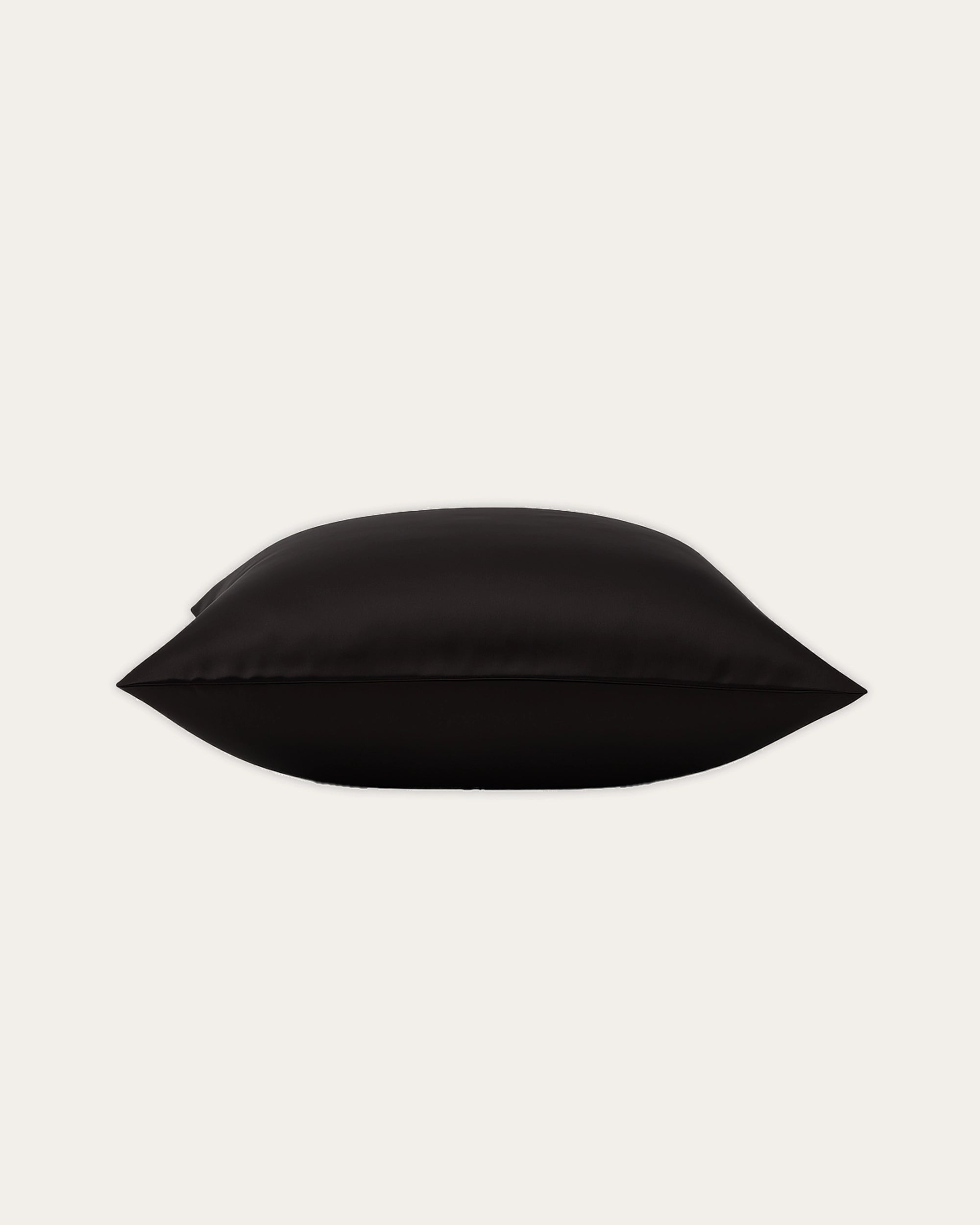 Black velour satin square pillowcase, modern design for smooth skin and hair protection.