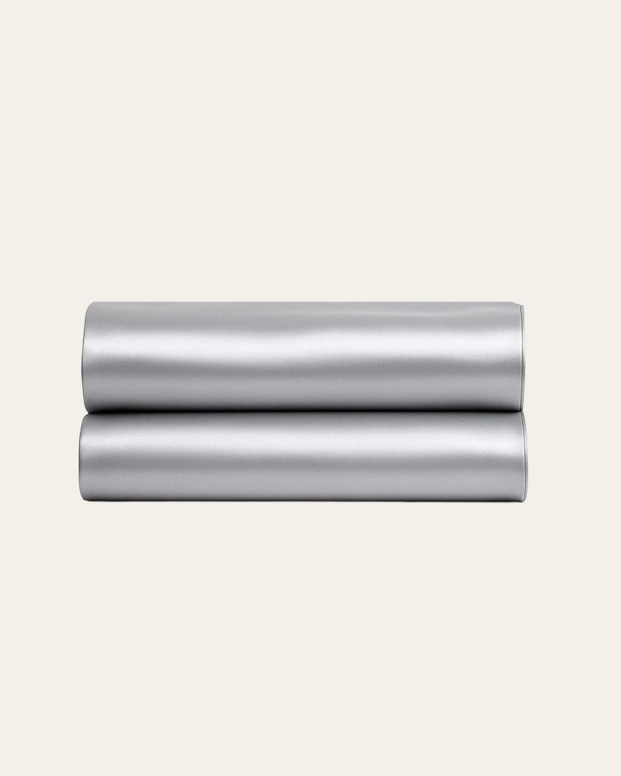Moonlight Silver Satin Fitted Sheets, showcasing a sleek metallic sheen, perfect for modern bedroom decor.